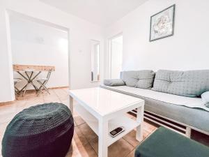 a living room with a couch and a table at Apartment Gottwald by Interhome in Starigrad-Paklenica