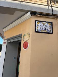 a sign on the side of a building at Cullera Mountain View in Cullera