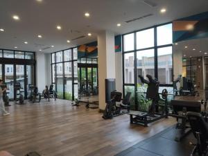 a gym with treadmills and exercise equipment in a building at PIK2 Tokyo Riverside Apartment Studio in Muara