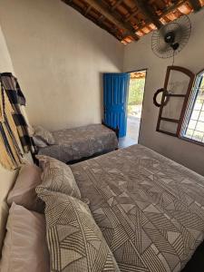 Katil atau katil-katil dalam bilik di Camping Solar da Colina