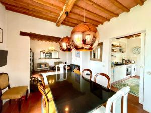 a kitchen and dining room with a table and chairs at Spectacular Views from Private Apartment in a Local Umbrian Village in Gioiella