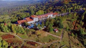 an aerial view of a large house on a hill at Mountain View Hotel Complex in Yabulkovets