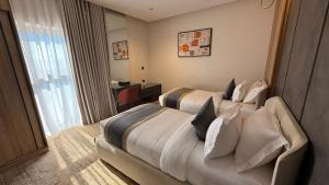 En eller flere senge i et værelse på فندق وايت سيزون حقل White Season Haql