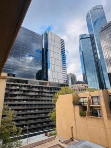 a view of a city skyline with tall buildings at Minimalist 2-Bed, 2-Bath Apartment in Melbourne CBD - Free Parking in Melbourne +7 photos