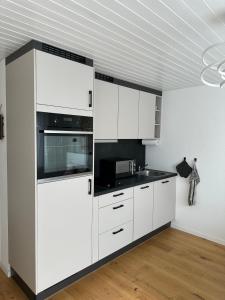Una cocina o cocineta en Gästehaus MaryVitty, zentrale zwischen Aarau und Olten, gut verbunden
