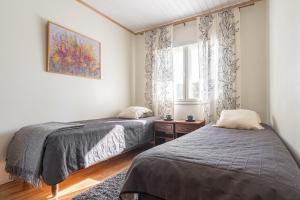 Postel nebo postele na pokoji v ubytování Karkutahko Villas 1A - Spacious 3BR Villa in Tahko with Private Sauna + 30 fotografií