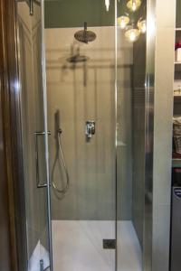 a shower with a glass door in a bathroom at Al Ventidue in Varese