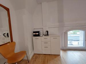 Kuchyň nebo kuchyňský kout v ubytování Centrum Lwowska + 40 fotografií