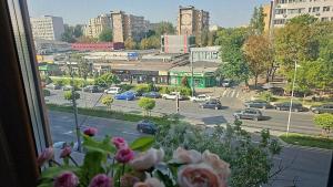 a view from a window of a city street with cars at Apartament Lux in Bucharest