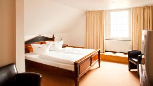 Ein Bett oder Betten in einem Zimmer der Unterkunft Waldhaus an de Miälkwellen
