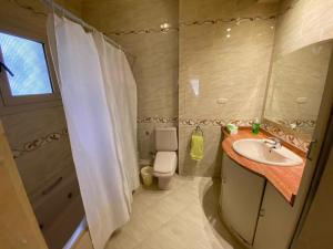 a bathroom with a sink and a toilet at Imperial room in Cairo +20 photos