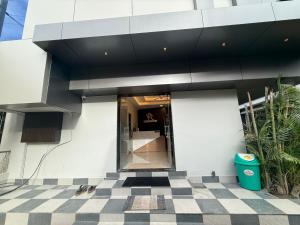 a building with a black and white checkered floor at Hotel Visawa Residency 5 min Walk From Mahalaxmi Temple Kolhapur in Kolhapur