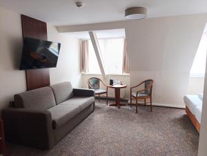 Posezení v ubytování REGIOHOTEL Bunte Stadt