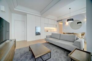 a living room with a couch and a table at Mirabilis Apartments - AAA23 in Lisbon