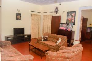 a living room with two couches and a coffee table at K & S Tours and imaduwa Guest in Imaduwa