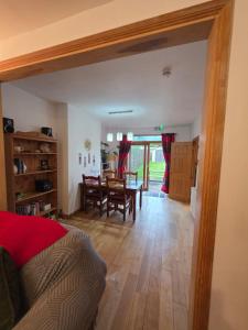 a living room with a table and a dining room at Orchard Serviced Accommodation in Aberdeen