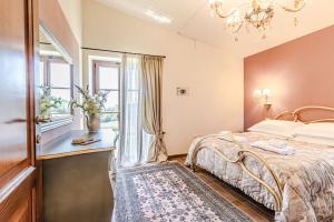 a bedroom with a bed and a window at Villa Cedri By Halldis in Montecatini Val di Cecina +33 photos