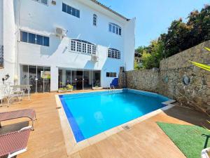 Foto de Casa no centro de Foz com churrasqueira e piscina