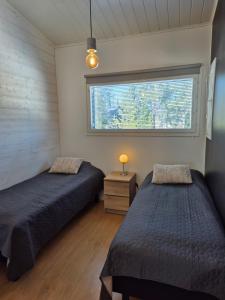 En eller flere senge i et værelse på Loikua