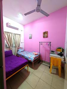 Кровать или кровати в номере Elsa Tawau homestay near Airport