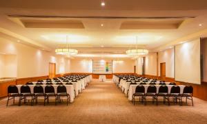 a large room with rows of tables and chairs at Fiesta Inn Monterrey Fundidora in Monterrey