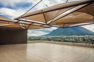 a large room with a view of a mountain at Fiesta Inn Monterrey Fundidora in Monterrey