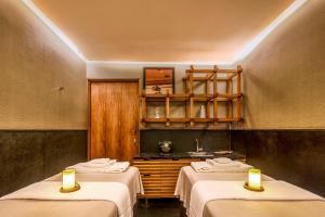a room with two beds with candles in it at Grand Fiesta Americana Monterrey Valle in Monterrey +49 photos