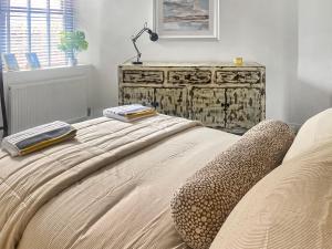 a bed with two pillows and a lamp on it at Clementi - Uk47197 in Penrith