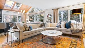 a living room with a couch and a table at Linksview Chalet North in Vail