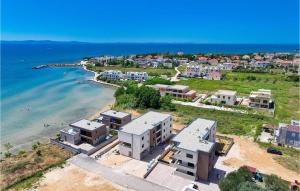 an aerial view of a beach with houses and the ocean at Beautiful Apartment In Privlaka in Glavan