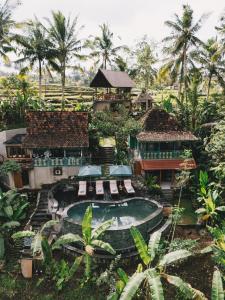 an aerial view of a resort with a swimming pool at Sokwayah Jungle Villas & Retreat in Ubud