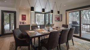 a dining room with a table and chairs at Orion Lodge in Steamboat Springs