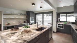 a kitchen with a sink and a counter top at Orion Lodge in Steamboat Springs