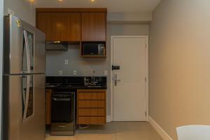 Kuchyň nebo kuchyňský kout v ubytování Loft Greige - Vista Linda, Ar Condicionado, Localização Incrível - AirPort