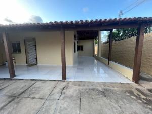 an empty patio of a house with a roof at Casa Brisas in Luis Correia