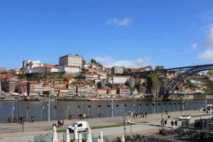 a view of a city with a bridge and a river at Panorama Apartments Ribeira Gaia in Vila Nova de Gaia
