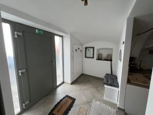 an empty hallway with a door in a house at City Center Deluxe in Kranj