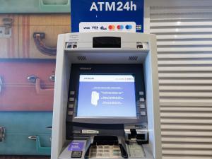 an atm machine with a screen on top of it at Ibis Foz do Iguaçu in Foz do Iguaçu