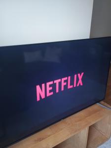 a netflix sign on the side of a laptop computer at La douce Parenthèse in Namur