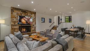 a living room with a couch and a fireplace at Radiance Retreat in Vail