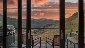 a view from the balcony of a house with mountains at Radiance Retreat in Vail