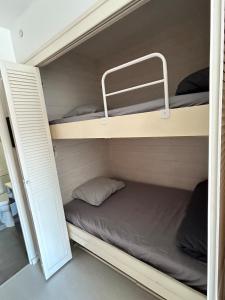 Postel nebo postele na pokoji v ubytování Le Petit Bois, plage, parking privé