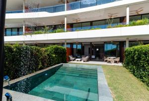 an external view of a building with a swimming pool at Eden Retreat Luxury 2BR with Private Pool in Fuengirola