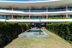 an external view of a building with a swimming pool at Eden Retreat Luxury 2BR with Private Pool in Fuengirola