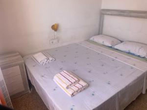 a white bed with two pillows on top of it at Panorama in Calpe +20 photos