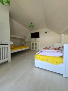 Postel nebo postele na pokoji v ubytování Sabina's Cozy House