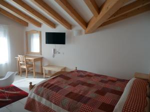 Posteľ alebo postele v izbe v ubytovaní Hotel Elbele Garnì