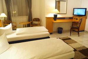 Postel nebo postele na pokoji v ubytování Hotel Rahlstedter Hof