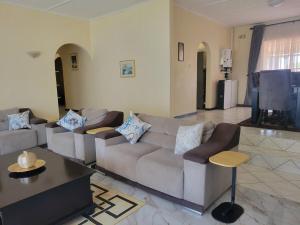 Posezení v ubytování Ekhayalethu Guest house