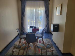 Posezení v ubytování Ekhayalethu Guest house